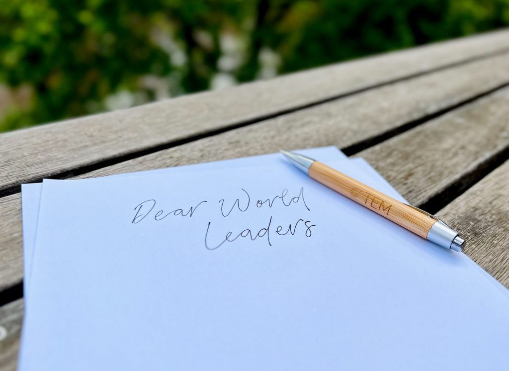 paper and pen with dear world leaders written